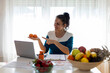 © Jelena - Attentive dietitian providing online consultation about client's progress in identifying foods.