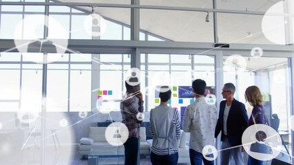 Poster - Animation of network of connections with icons over diverse colleagues discussing work in office