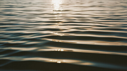 background image of sea water with soft waves and reflection of sunlight