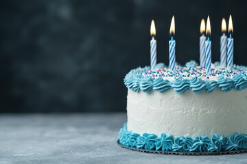 Wall Mural - Festive birthday cake with blue frosting and candles