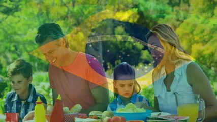 Canvas Print - Animation of flag of brazil over caucasian family on eating in garden