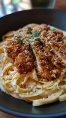 Wall Mural - Crispy Chicken Cutlets on Creamy Fettuccine Pasta with Parsley