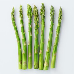 Wall Mural - A bundle of bright green asparagus stalks, ready for cooking.