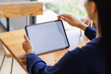Business asian woman freelancer using tablet with blank screen for design mockup device Tablet with blank screen for design mockup
