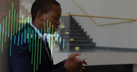 Wall Mural - Animation of diagrams over biracial businessman using smartphone