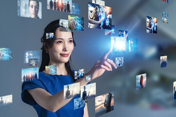 Fototapete - A woman operating a stereoscopic video screen