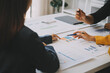 © ARMMY PICCA - Financial analysts analyze business financial reports on a digital tablet planning investment project during a discussion at a meeting of corporate showing the results of their successful teamwork.