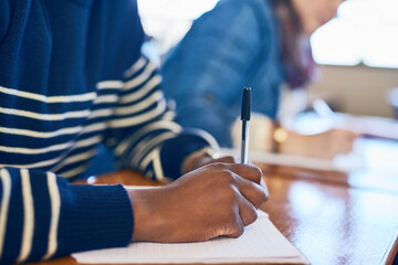Poster - Hands, writing and test in classroom at university with people, students and notebook for assessment. Person, exam or quiz with question paper, learning and education with solution at university