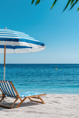 Blue umbrella on the tropical beach for vertical background