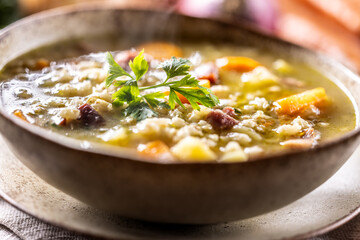 Wall Mural - Soup made from barley groats, smoked pork neck, potatoes and root vegetables