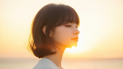 Wall Mural - Serene Japanese Woman Embracing Self-Acceptance at Sunset on Quiet Beach