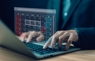 Fototapete - man plan and schedule calendar online on a laptop. concept of managing a planning meeting, arranging appointment agendas in business, and timeline design on technology digital