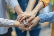 © Anna - Office worker team stacking hand together symbolize successful group of business partnership and strong team