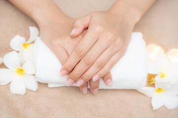 woman show beautiful nail after receive care service by professional beautician manicure at spa cent
