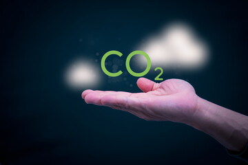 Ideas for reducing carbon emissions or using carbon credits for organizations. Businessman showing carbon credit and green business environmental conservation sustainable environmental development