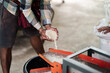 © Charnchai saeheng - A farmer shows rice being milled using a rice mill on his hand.