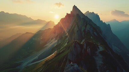 mountain peak silhouetted against a vibrant sunset. The golden rays of the setting sun illuminate the landscape, creating a sense of awe and wonder.