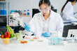 © Nuttapong punna - Food scientists in lab coats, testing samples, and analyzing food safety and quality in a laboratory