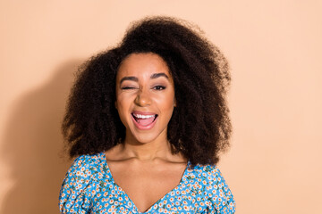 Poster - Photo of flirty positive woman wear blue top winking eye empty space isolated beige color background