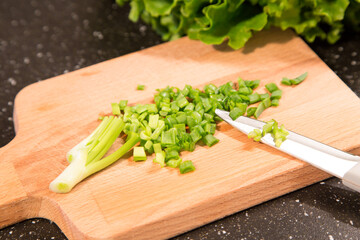 chopped green onion and the knife