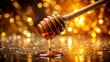 © Triple P - Close up of honey dripping from dipper with shimmering reflections, highlighting freshness and purity