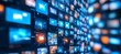 © Ilja - Abstract Blurred Wall of Digital Screens with Social Media, News, and Video Content Playing on Them