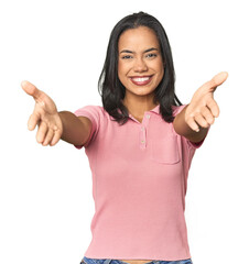 Wall Mural - simple portrait of a young latina showing a welcome expression.
