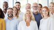 © Robert Kneschke - Portrait of a successful group of diverse business people, smiling confidently in a bright modern office environment, showcasing teamwork and professional growth