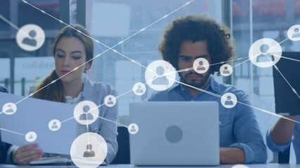 Poster - Animation of network of connections with icons over diverse colleagues using laptops in office