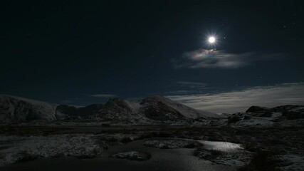 Wall Mural - Aurora over mountains with moon and bit of cloud cover.