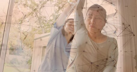 Wall Mural - Animation of dna strand and medical data processing over diverse female physiotherapist and patient