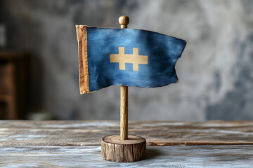 a small blue flag on a wood stand

