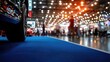 © ColorfulFlowerStudio - Blurred background of a car show with blue carpet