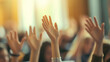 © Michael - Group of people raising hands to ask questions during a conference or business meeting