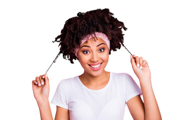 Wall Mural - Close-up portrait of her she nice-looking charming cute attractive lovely winsome sweet cheerful cheery optimistic wavy-haired girl pulling curls isolated over pink pastel background