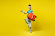 © ViDi Studio - Full body Traveler Latin woman wear blue casual clothes hold suitcase bag pov play guitar isolated on plain yellow background. Tourist travel abroad in free time rest. Air flight trip journey concept.