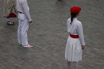 Basque folk dancers during a performance in an outdoor festival