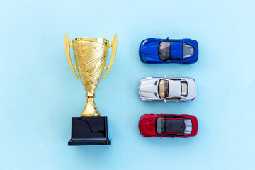 Champion golden trophy cup with car model. First place winning the competition concept