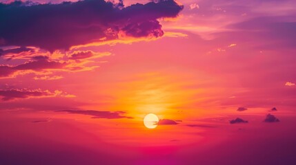 Poster - The setting sun creates a spectacular display of color, with vibrant oranges and deep purples merging into a beautiful evening sky.