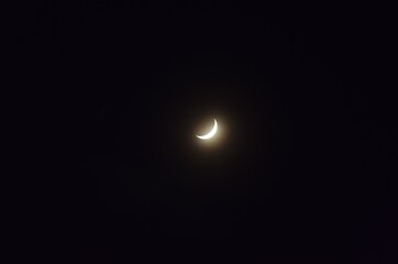 Wall Mural - half moon floating on dark sky in night