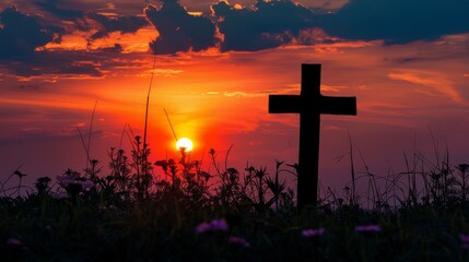 Cross silhouette against a vibrant sunset sky