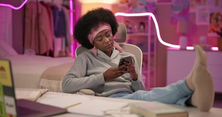 Poster - Girl, phone and texting at night in home, books and study with break for game, chat or reading post. Black woman, smartphone and relax in bedroom with neon light, mobile app or social media in house