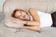 © F8  \ Suport Ukraine - Profile of a woman relaxing lying on a couch at home