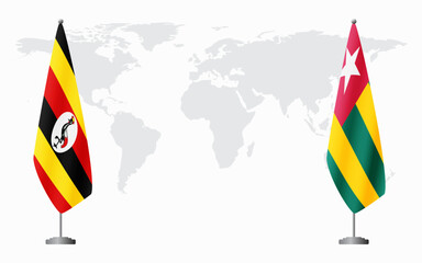 Wall Mural - Uganda and Togo flags for official meeting against background of world map.