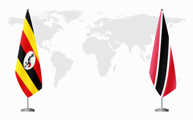 Wall Mural - Uganda and Trinidad and Tobago flags for official meeting against background of world map.