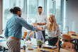 © Dragana Gordic - Business People Shaking Hands in a Modern Office Meeting