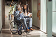 © Dragana Gordic - Professional Interaction with Colleague in Wheelchair at Office