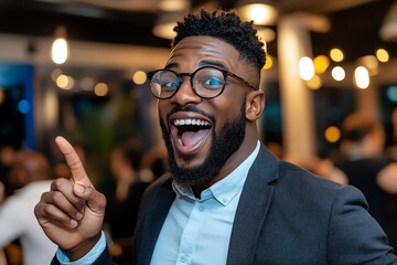 Man in a jump, pointing toward a friend across the room, sharing the excitement of the moment in a lively atmosphere