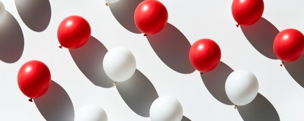 Wall Mural - Red and white balloons creating pattern on white background