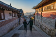 © Noppasinw - Seoul South Korea sunrise of Korean traditional house at Bukchon Hanok Village with lover couple tourists